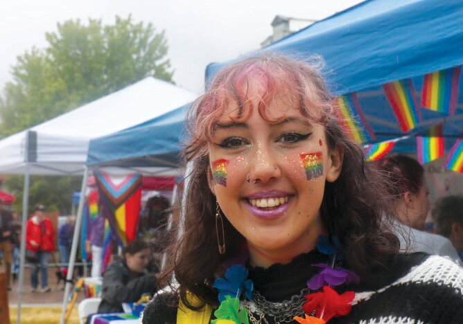 Bina F. of Jefferson County rocked glitter face paint and a big smile at Saturday’s Pride gathering at Pope Marine Park. “It brings people together,” she said.